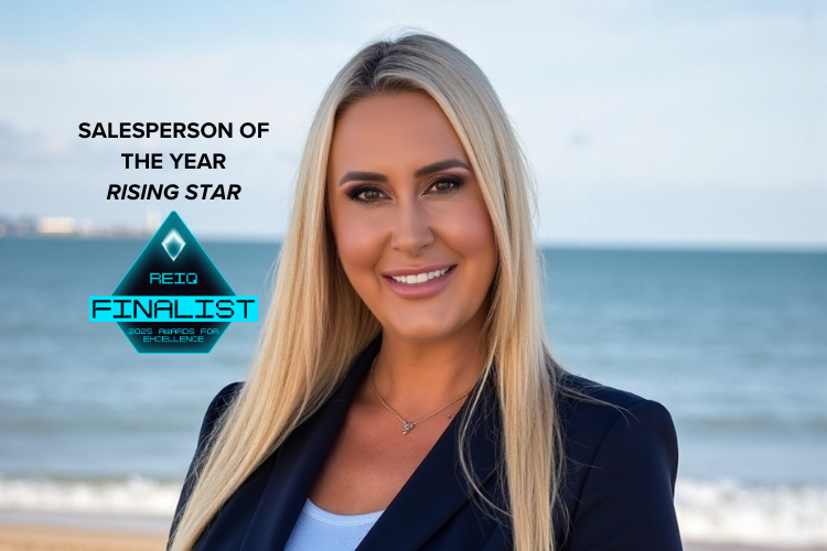 Hervey Bay real estate agent Jasmine Corrick, REIQ Salesperson of the Year Rising Star Finalist 2025, smiling confidently on the beach in Hervey Bay. 